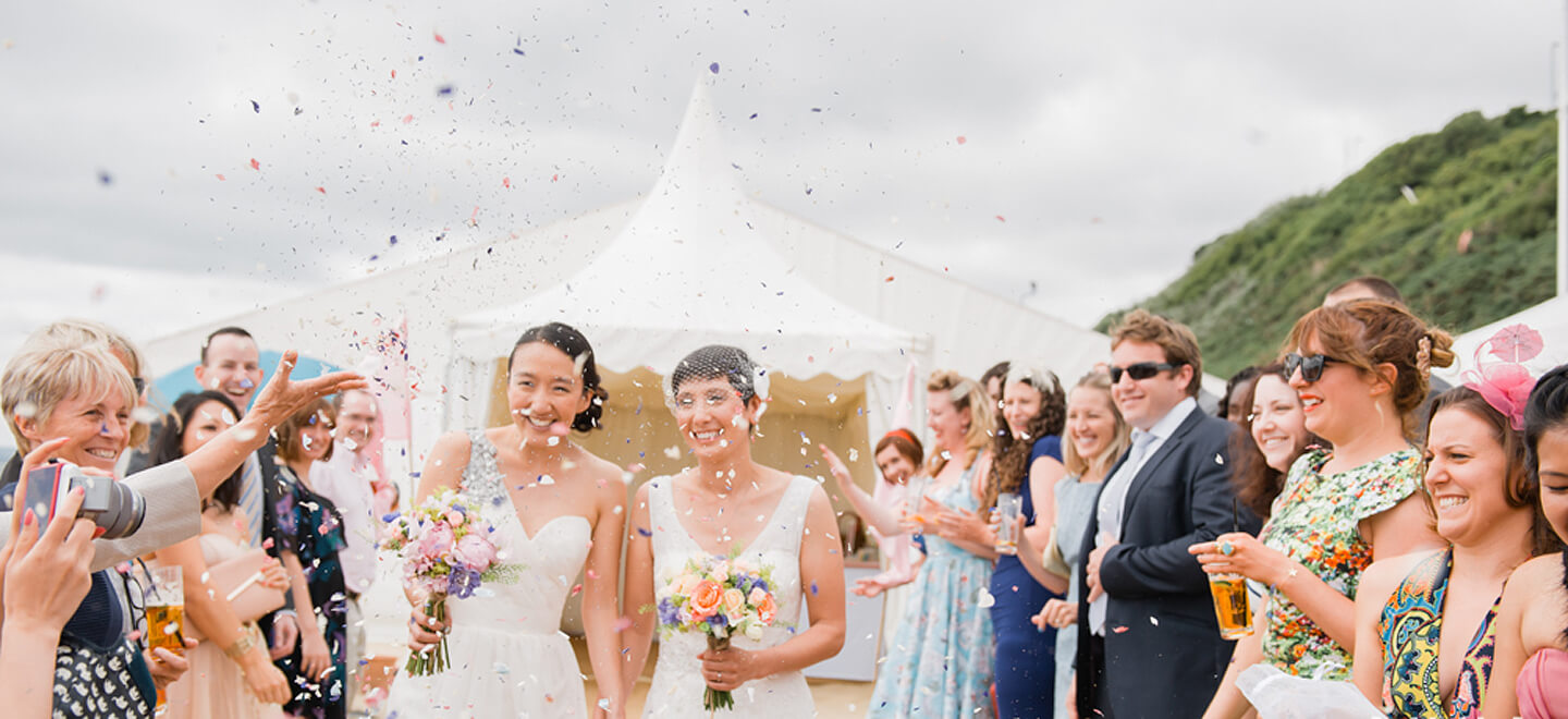 Confetti Covers Lesbian Couple at Beach Weddings Bournemouth Gay Wedding Guide image copyright Anna Morgan Photography