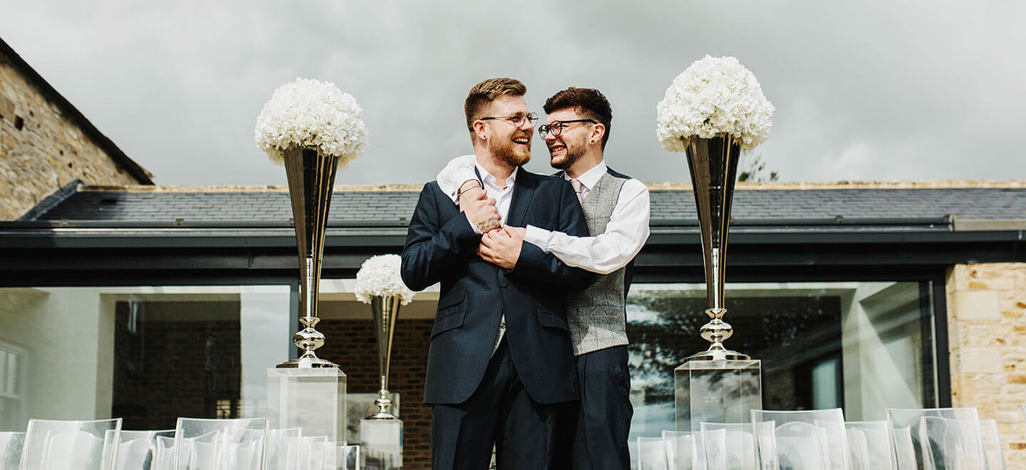 Gay grooms outside High Leases Farm DIY Wedding Venue Yorkshire Gay Wedding Guide 1 1