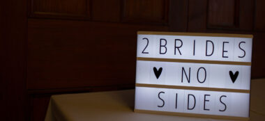 1 Two Brides No Sides Sign At Jak And Jules Lesbian Wedding Image Copyright Ragdoll Photography Via The Gay Wedding Guide 3 5 380X174
