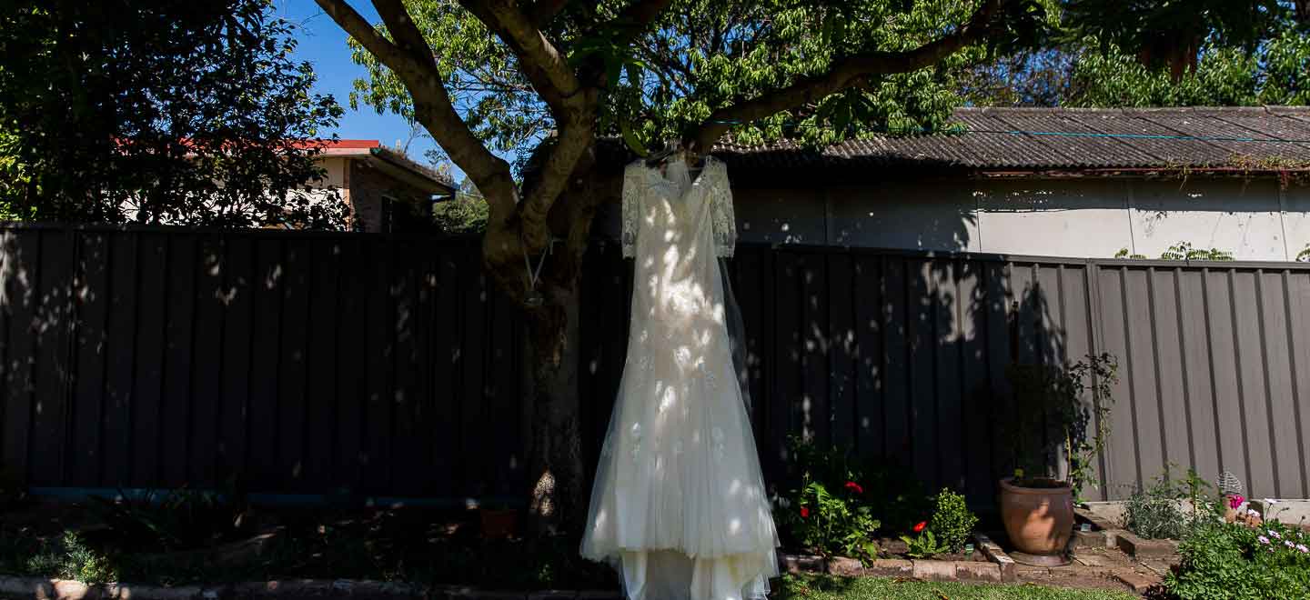 1 wedding Dress hangs on treet image by Next Chapter Photography London wedding photographer Sydney via Gay Wedding Guide 6