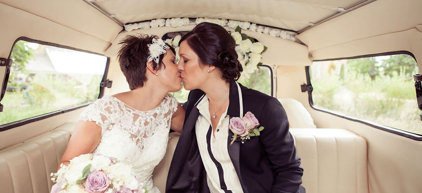 14 lesbian brides kiss in car at lesbian wedding image by Newcastle wedding photographer Erica Tanith Photography via Gay Wedding Guide 6