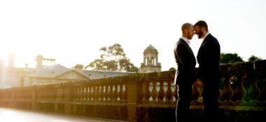 1440 Chris And Ben Outside With Sun Rays At Their Gay Wedding Gatsby Themed Gay Wedding Guide 3 380X174
