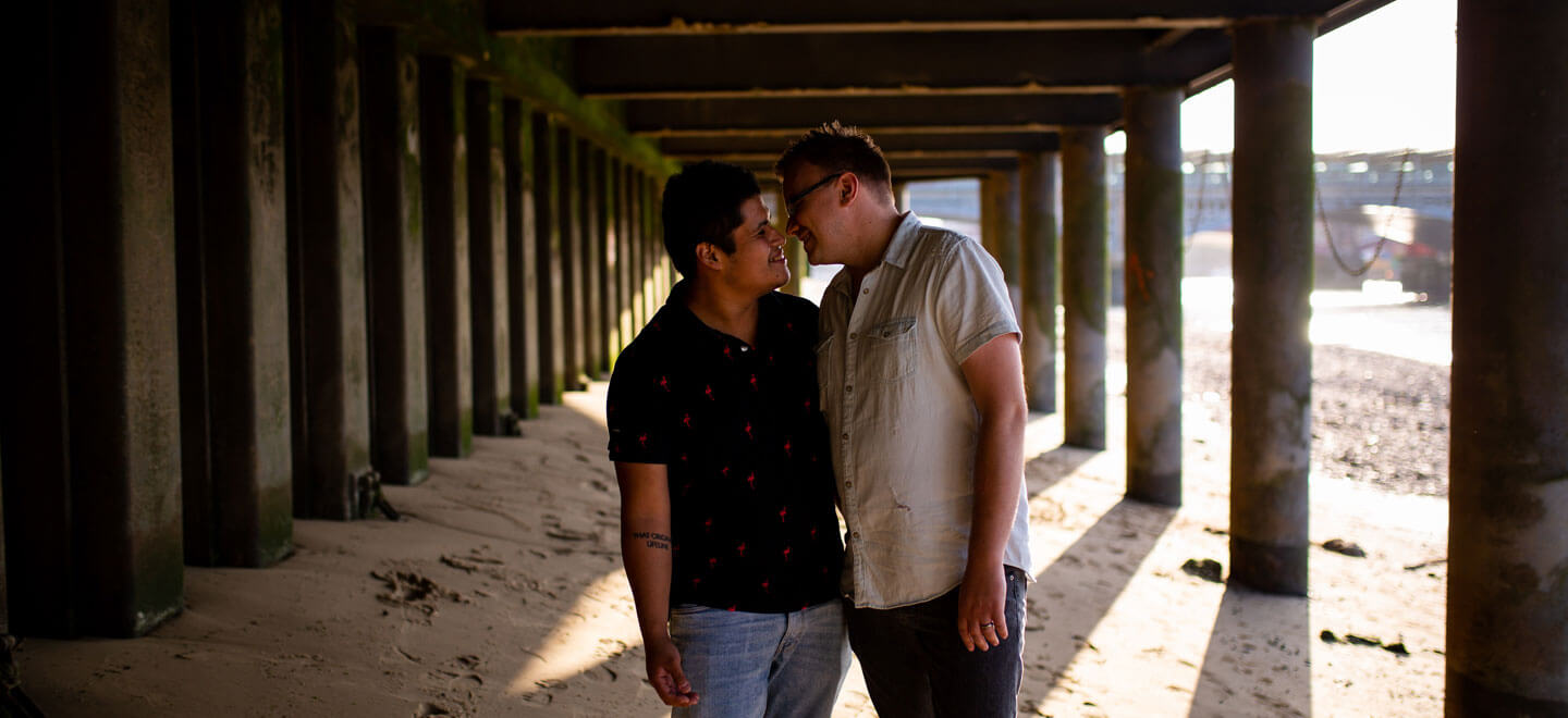 1440 Neill Iggy Look At Each Other Under Bridge On Gay Engagement Shoot On London Southbank Image By Engagement Chapter Via Gay Wedding Guide 1 4