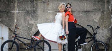 2 Two Lesbian Brides By Bikes Copyright Shotgun Weddings Via The Gay Wedding Guide 6 380X174