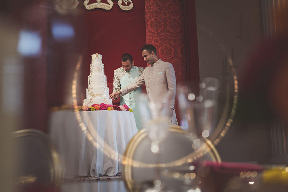 20 cutting cake at Jai and Milan Gay Wedding Banqueting House Palace Gay Wedding Guide 1 5