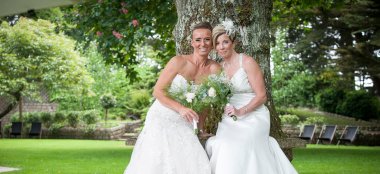 5 Lesbian Brides Pose By Tree At Wickwoods Country House And Spa West Sussex Wedding Venue Gay Wedding Guide 9 380X174