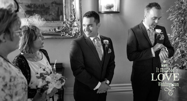 8 Groom looks at his watch image by It Must Be Love Weddings Photographer Hampshire via Real Gay Wedding on the Gay Wedding Guide 3 5