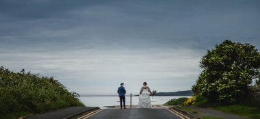 8 Lesbian Brides Walk To Edge Of Pier At Lesbian Wedding Image By Newcastle Wedding Photographer Erica Tanith Photography Via Gay Wedding Guide 6 380X174