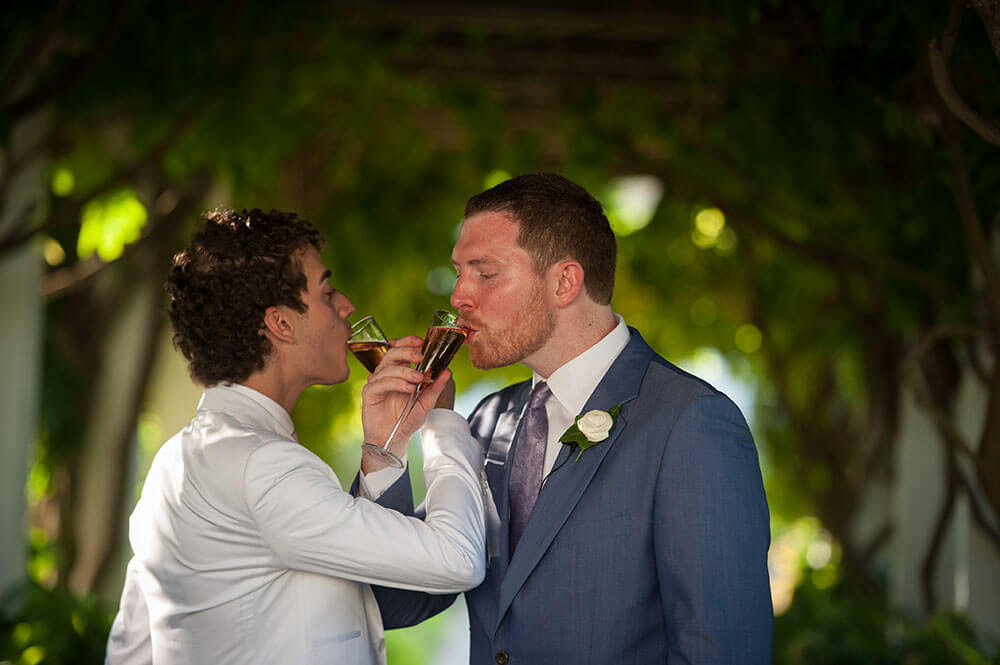 9 champagne drinking at Alex and Havens gay wedding Long Island Gay Wedding Guide image by Caroline Rochetta 1 5