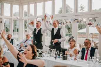Aaron And Keith Wave Napkins At Their Gay Wedding Hampshire At The Elvetham Photographer Dm Photography 1 5 344X230