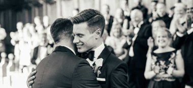Aaron And Phil Embrace At Their Gay Wedding At The Bodelian Oxford Images Copyright Stu Heppell Via The Gay Wedding Guide 3 5 380X174