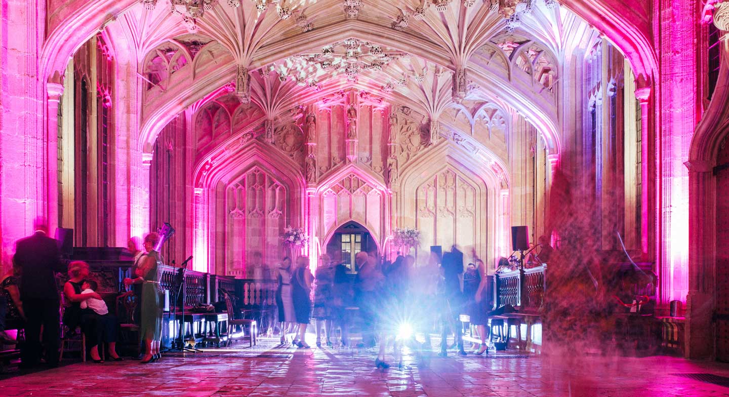 Aaron and Phil pink lit dancefloor at their gay wedding at the Bodelian Oxford images copyright Stu Heppell via The Gay Wedding Guide 3 5