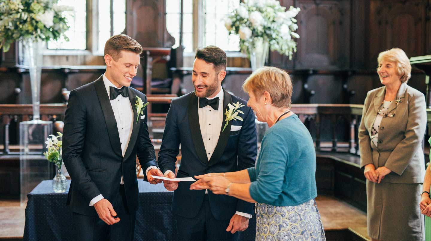 Aaron and Phil with marriage certificate at their gay wedding at the Bodelian Oxford images copyright Stu Heppell via The Gay Wedding Guide 3 5