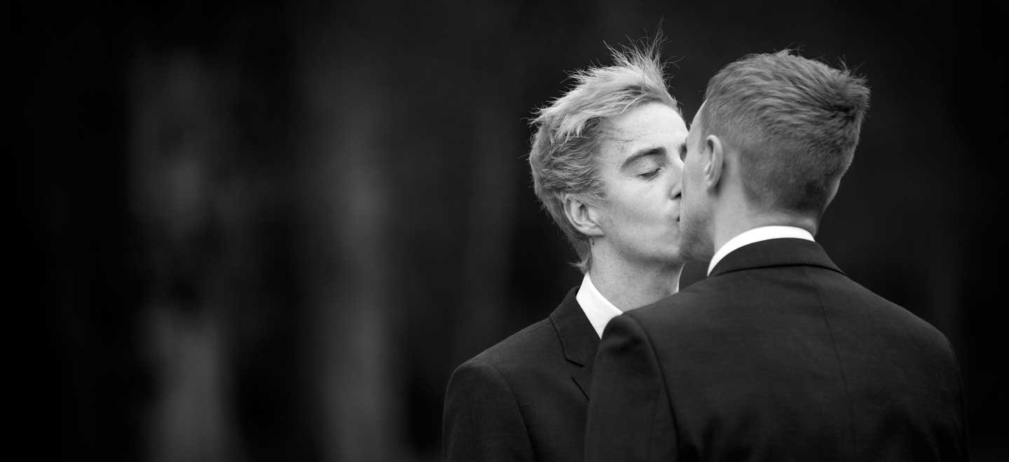 Alan and James kiss at their gay wedding black and white photo copyright Sarah Illingworth via the Gay Wedding Guide 3 5