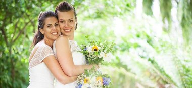 Ale And Eva Real Lesbian Wedding Brides Cuddle Image Copyright Paola De Paola Photography Via The Gay Wedding Guide 3 5 380X174