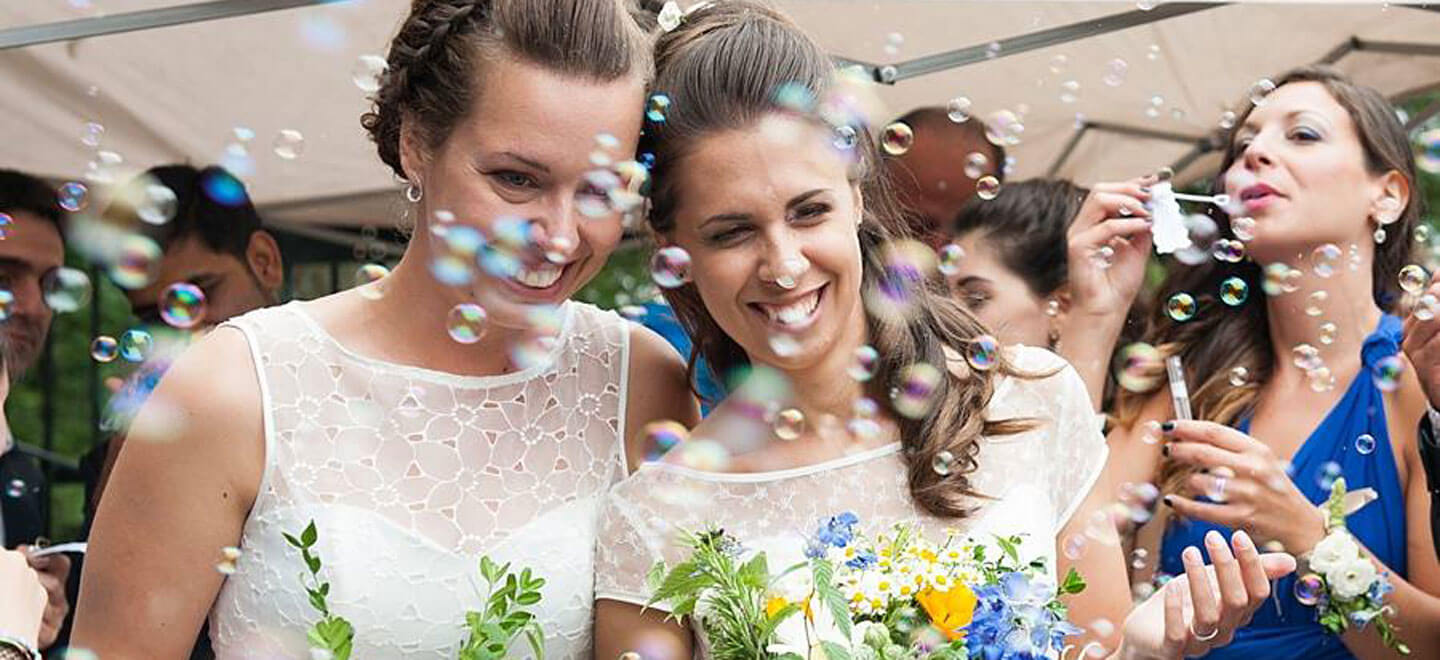 Ale and Eva real lesbian wedding bubbles image copyright Paola De Paola Photography via The Gay Wedding Guide 1 3 5