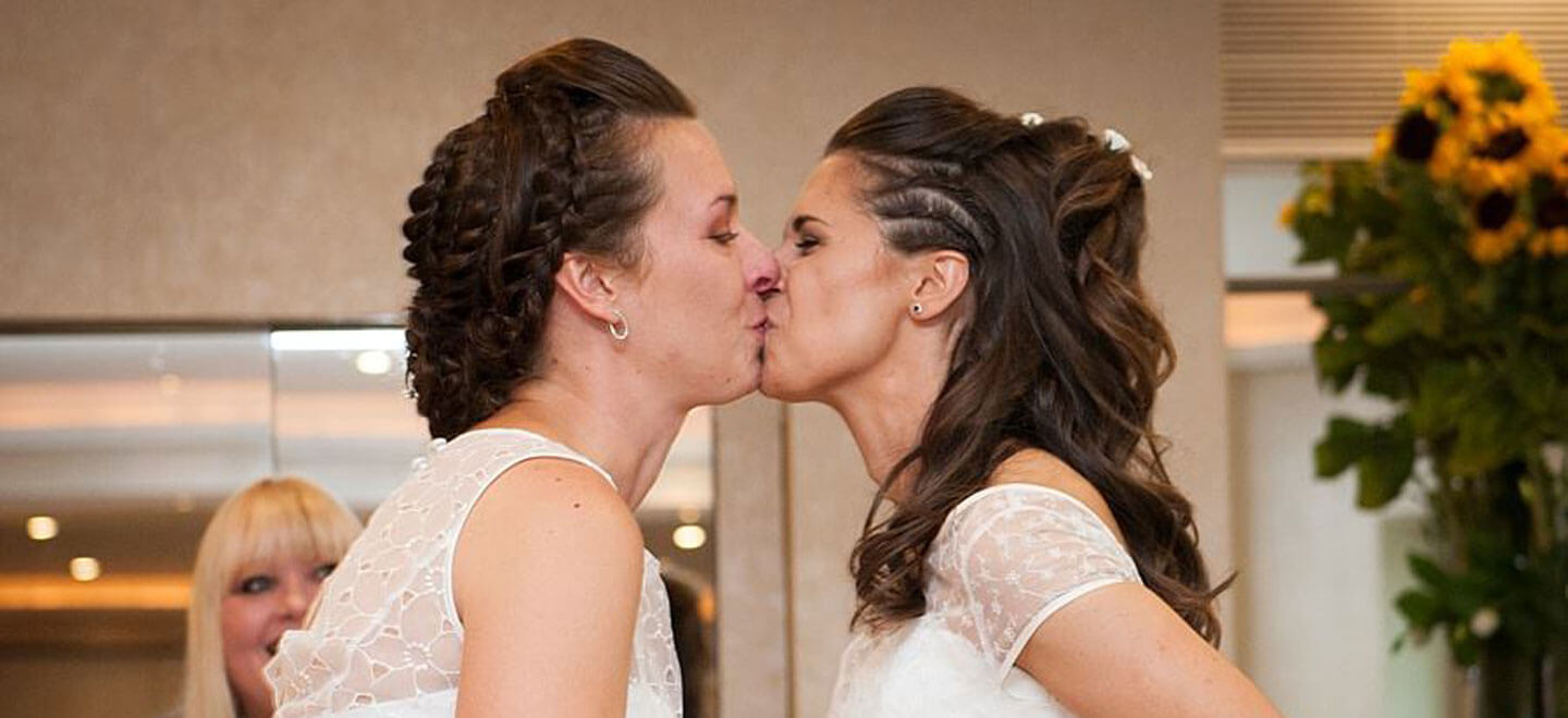 Ale and Eva real lesbian wedding kissing brides image copyright Paola De Paola Photography via The Gay Wedding Guide 3 5