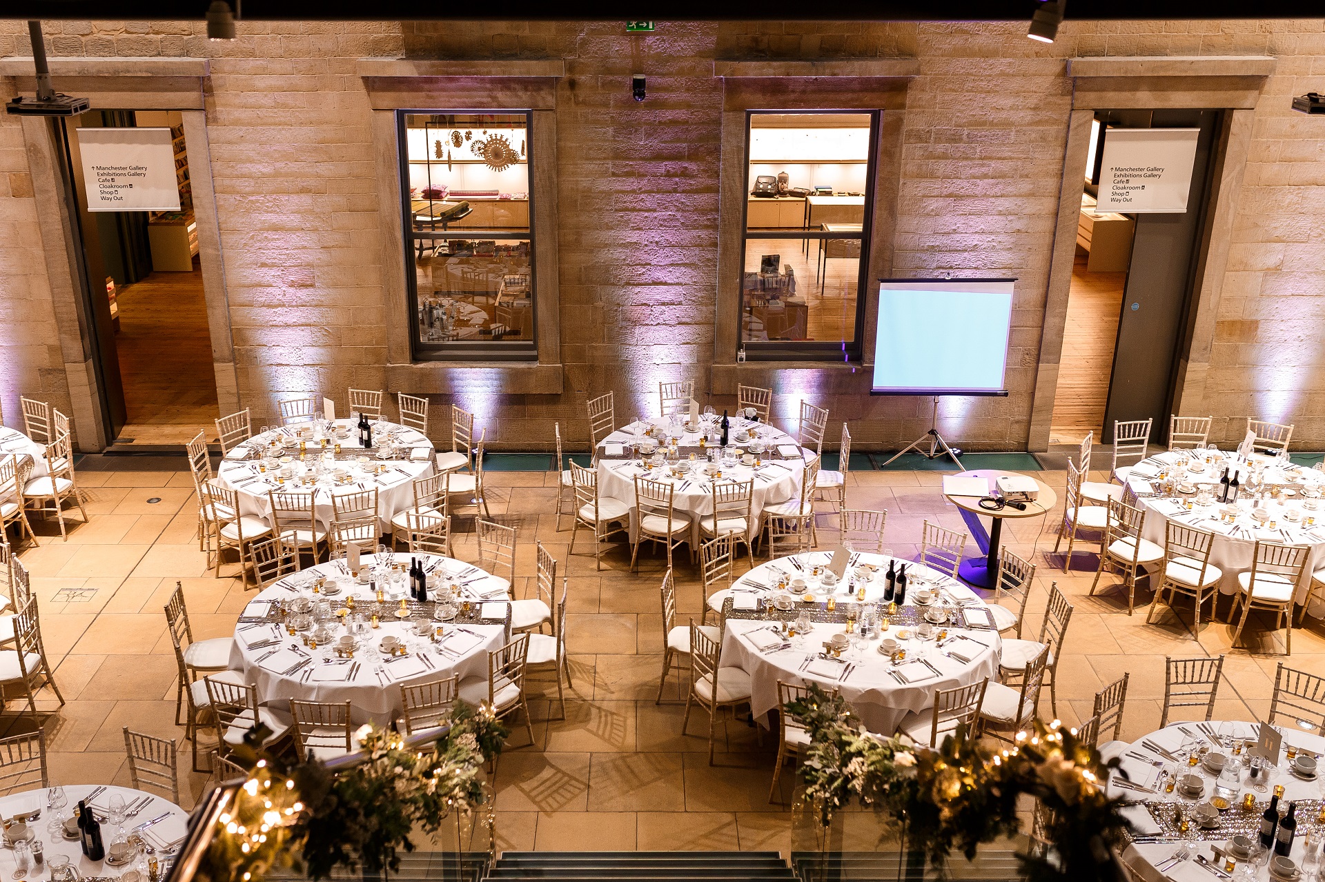 Atrium wedding dining with gold chairs resized