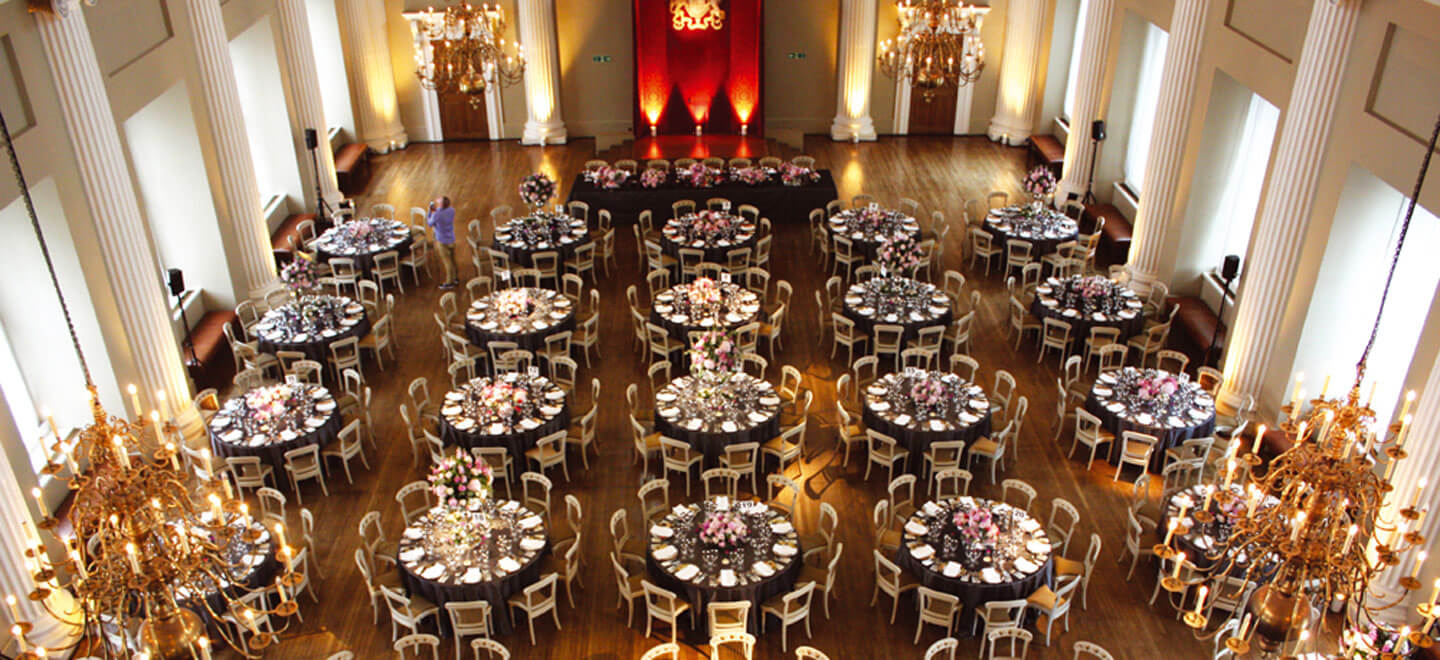 Banqueting House reception layout circular tables a Royal Palace Wedding Venue in London via the Gay Wedding Guide 9