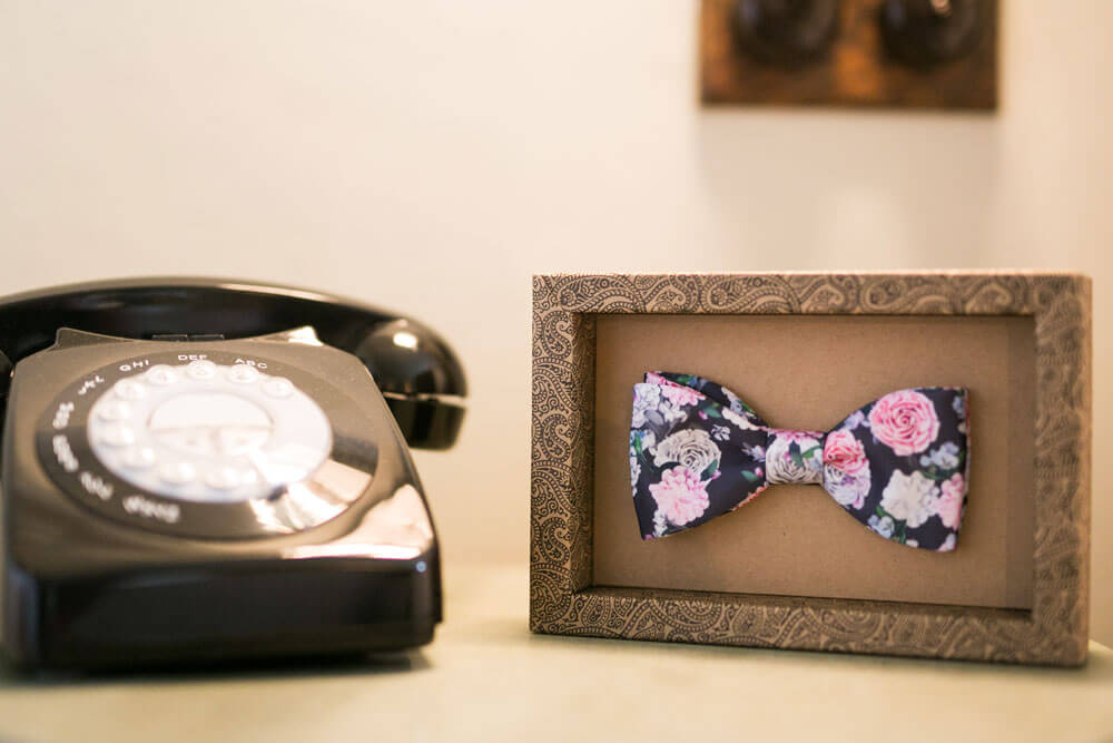 Bowtie in a frame at David and Stephen real gay wedding image by Ryan Welch Photography via the Gay Wedding Guide 1 5