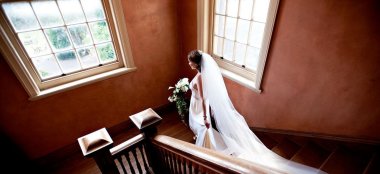 Bride On Stairs At Hampton Court House Country House Wedding Venue Surrey Gay Wedding Guide 9 380X174