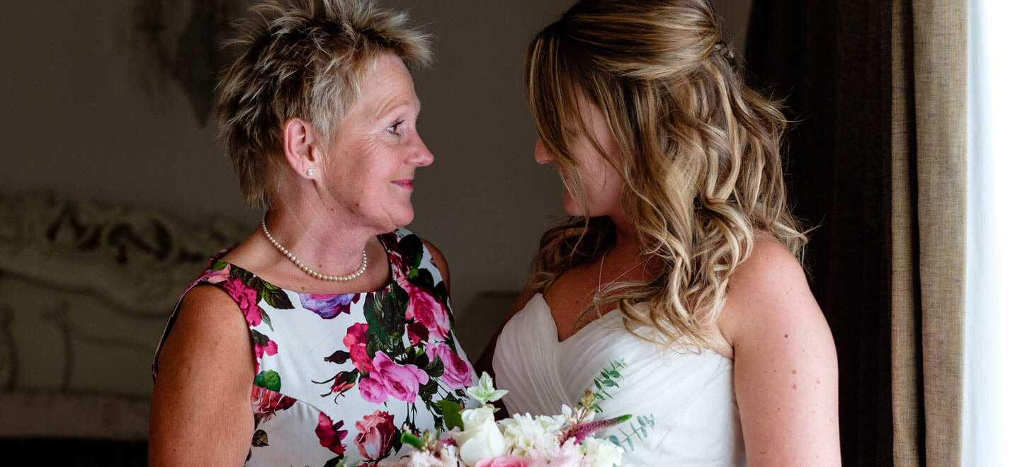 Bride with mum at Emily Jodie lesbian wedding Devon at Ocean Kave copyright Michael Wells via the Gay Wedding Guide 3 5
