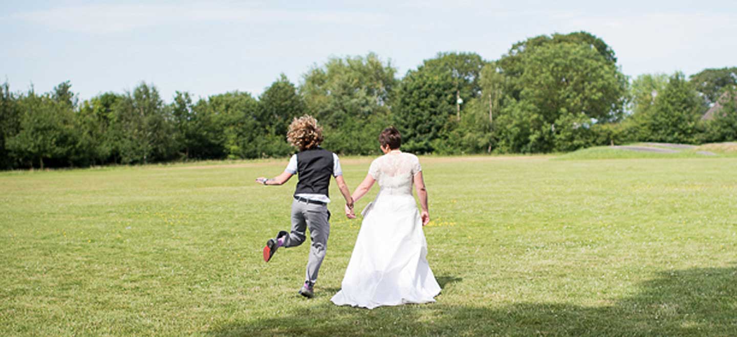 Brides walk off into distance by gay wedding photographer Corinne Fudge 1 1 6