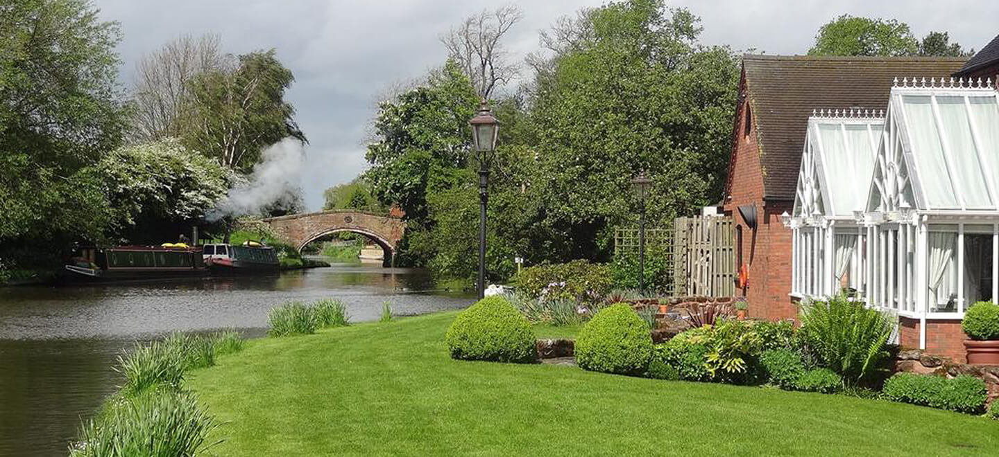 Bridge over lake at The Moat House Wedding Venue Staffordshire gay wedding guide 9