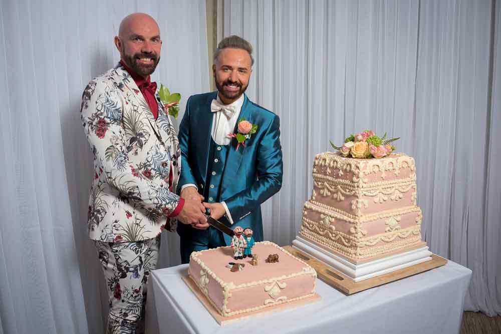 Chris and Tony cut their cake at their Real Gay Wedding at the Grand via The Gay Wedding Guide 1 5