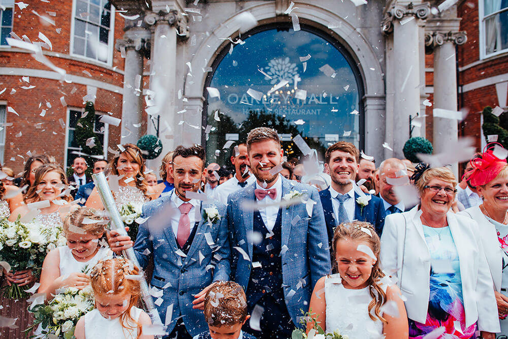 Confetti shower at Lee and Simon Gay wedding at Bombay Sapphire Distillery Gay Wedding Guide image by This and That Photography 1 5