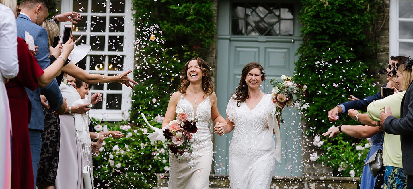 Confetti shower over Lesbian brides at Kingston Estate Country House Wedding Venue Devon Gay Wedding Guide 9