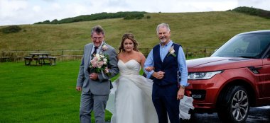 Dads With Bride At Emily Jodie Lesbian Wedding Devon At Ocean Kave Copyright Michael Wells Via The Gay Wedding Guide 3 5 380X174