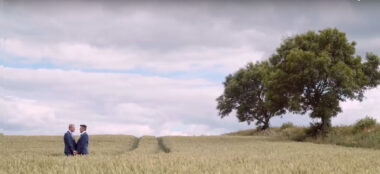David And Nick Stand In A Cornfield After Their Gay Wedding Image By Real Films Via The Gay Wedding Guide 6 380X174