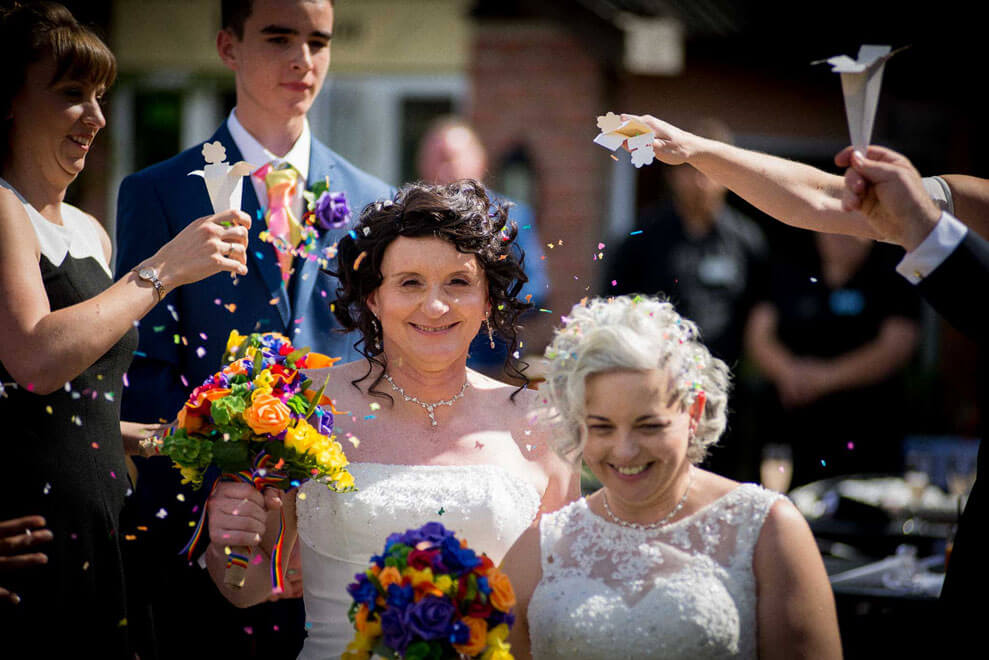 Denise Kristiana confetti at their real lesbian wedding image copyright Zac Photography via gay wedding guide 1 5