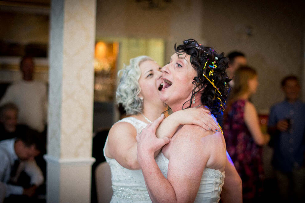 Denise Kristiana smiling at their real lesbian wedding image copyright Zac Photography via gay wedding guide 1 5