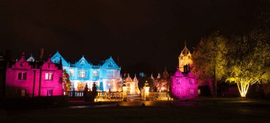 Dorfold Hall At Night Lit In Pink And Blue Wedding Lighting Nantwich Gay Wedding Venue Cheshire Via The Gay Wedding Guide 9 380X174