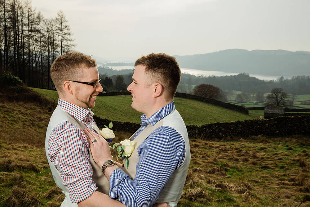 Embrace view by lake at Danny and Andy real gay wedding image copyright DK Ashton Photography via Gay Wedding Guide 2 5