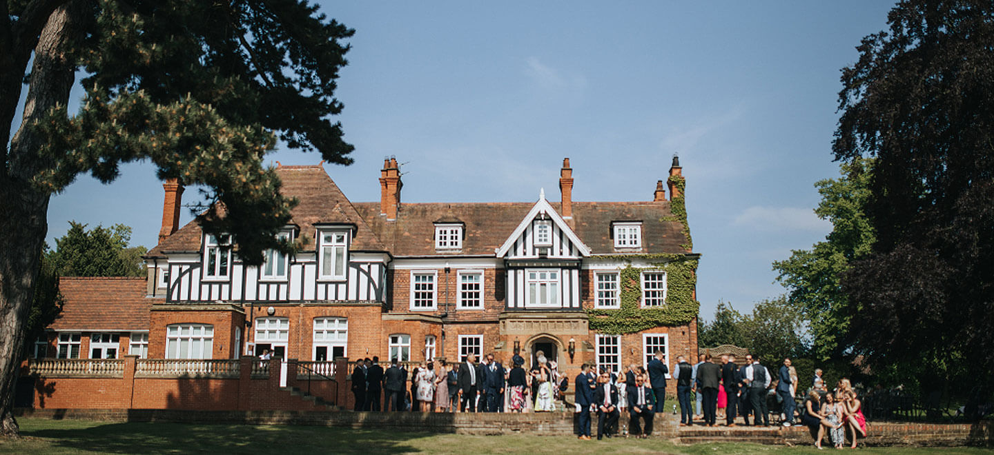 Exterior view with guests at Healing Manor Country House Wedding venue Lincolnshire gay wedding guide 9