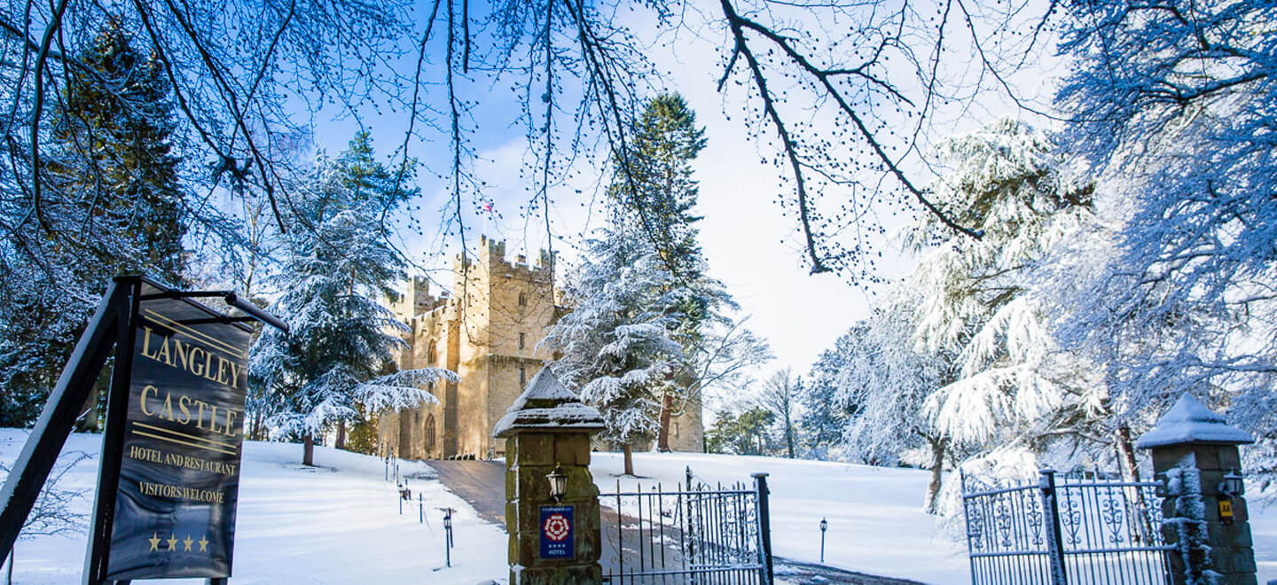 Exterior with snow at Langley Castle Wedding Northumbria UK via the Gay Wedding Guide 9