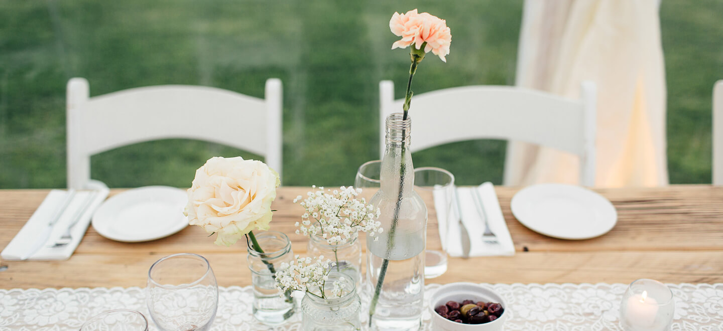 Flower vases at Wedding Breakfast at Kilminorth Cottages DIY Wedding Venue Cornwall Gay Wedding Guide 9