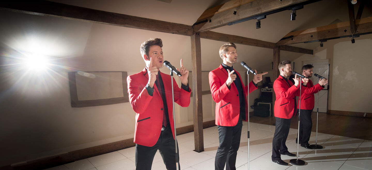 Four singers at Guy and Marks gay wedding Gaynes Park image copyright Steve Hobart Photography via the gay wedding guide 1 5