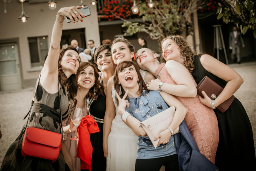Friends take selfie at Agnesa and Gaia lesbian wedding photography Frank Cattuci Photo via Gay Wedding Guide 1 5