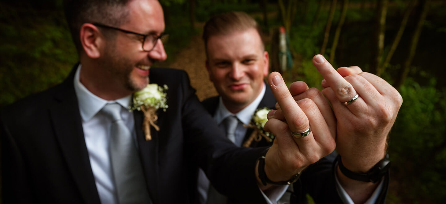 Gay grooms give the finger photograph by Paul Walker Photographer Gay Wedding Guide 6