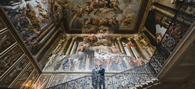 Gay Grooms Stand At The Top Of The Kings Stairs At Hampton Court Palace Unique Royal Wedding Venue Surrey Gay Palace Wedding Guide 9 380X174