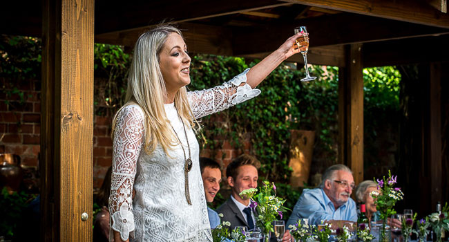 Guest makes a toast image shot a manchester gay wedding by James Tracey Photography a gay wedding photographer in Manchester via the Gay Wedding Guide 3 5