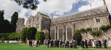 Guests Mingle At Outdoor Wedding Devon Country House Wedding Venue Dartington Hall Via Gay Wedding Guide 9 380X174