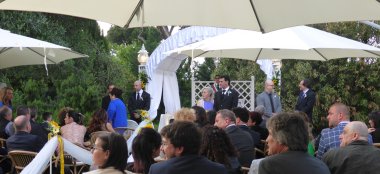 Guests Take Seats At Outdoor Lesbian Wedding With Gay Wedding Celebrant Italy Tonigar Ceremony By Antonino Via Gay Wedding Guide 6 380X174