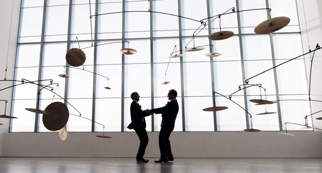 Guy and Andrew dance inside the Turner Contemporary at their same sex wedding reception in margate photo by Webb Weddings 3 5