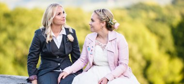 Hemmingway Tailors Gender Neutral Wedding Wear Suits For Brides Sitting Outside Via Gay Wedding Guide 6 380X174