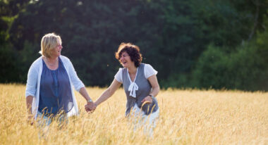 Isabelle And Susie Walking Through The Wheat Fields At Their Same Sex Wedding Copyright Jennifer Bedlow Photography Via The Gay Wedding Guide 4 380X206